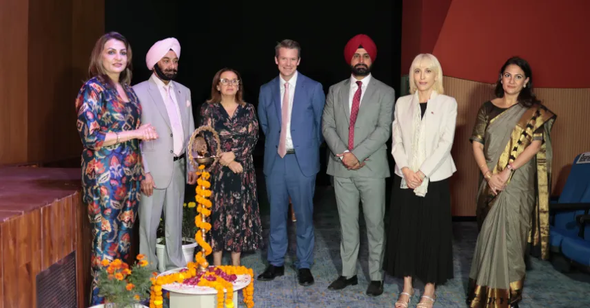 School leadership and distinguished guests lighting the ceremonial lamp during the 100-day celebration⁠