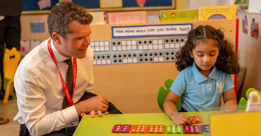 Mr Iwan Lloyd interacting with a Bedford School Mohali pupil during a classroom activity.